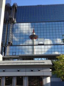 Kyoto Tower, reflected in the station building.